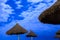 Palm parasols on moonlight beach