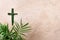 Palm Sunday concept. Cross made of palm and tropical leaves. Christian moveable feast to celebrate Jesus' triumphal