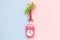 Palm tree and alarm clock toys on pastel background minimalistic summer vacation tropical concept.
