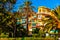 Palm tree and colorful hotel with balconies