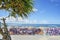 Palm tree and seaside rampart decorated with graffiti on the Sunset beach in Chatan City in the American Village of Okinawa island