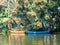 Palm trees ancien boats at Alleppey Kerala houseboats Alappuzha Laccadive Sea Indian state Kerala known for wooden houseboats