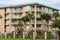 Palm Trees Around Tropical Stucco Condos