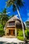 Palm trees and beach bungalow, Bandos Island, Maldives