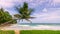 Palm trees beach front at beautiful nature landscape of blue sky and sea view seascape Morning soft sunlight shine on green coconu