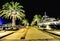 Palm trees and the buildings in the night lights in Marina Porto