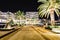 Palm trees and the buildings in the night lights in Marina Porto