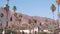 Palm trees in city near Los Angeles, street road sign, semaphore traffic lights.