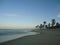 Palm trees on Cumbuco beach in the evening.