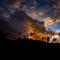 Palm trees destroyed by Super Typhoon Odette Philippines. Silhouetted at sunset.