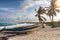 Palm trees and fisher boats on the Playa Publica beach on Cozumel island