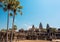 Palm trees over historical Angkor What temple, 12th century Khmer landmark of Cambodia. UNESCO World Heritage Site