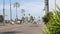 Palm trees on Route 101 highway, pacific coast, Oceanside, California USA. Suburb road intersection.