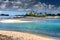 Palm trees on the seashore under the storm sky