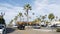 Palm trees on typical american street. Auto transport, generic city view. Oceanside, California USA.