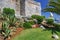 Palm trees and the wall of an ancient fortress, Cascais, Portugal