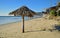 Palm umbrella on Shoreline at Thalia Street Beach in Laguna Beach, California.