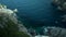 Palma de Mallorca, Spain,beautiful cliffs, high-up view, rocks and many plants and trees, sea in the background, Spanish flora