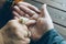 Palmistry fortune teller reads lines on man hand or palm to tell his future, top view, selective focus