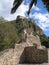 PALMS, CLOUDS AND ANCIENT RUINS