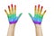 Palms of human hands painted in rainbow colours