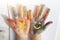 Palms painted on childrens hands with multi-colored paints. Childs hobby creativity and art. Children Protection Day. Happy