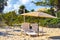 Palms parasols sun loungers beach resort Playa del Carmen Mexico