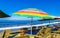 Palms parasols sun loungers beach waves Puerto Escondido Mexico