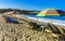 Palms parasols sun loungers beach waves Puerto Escondido Mexico