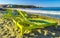 Palms parasols sun loungers beach waves Puerto Escondido Mexico