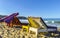 Palms parasols sun loungers beach waves Puerto Escondido Mexico