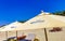 Palms parasols sun loungers beach waves Puerto Escondido Mexico