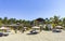 Palms parasols sun loungers beach waves Puerto Escondido Mexico