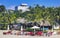 Palms parasols sun loungers beach waves Puerto Escondido Mexico