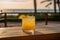 Paloma cocktail, on a wooden table with stunning ocean view, beach as the backdrop,. Generative AI