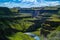 Palouse Falls Canyon under blue sky with white clouds