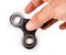 Palying with a Black Fidget Spinner