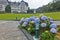 The PalÃ¡cio Quitandinha Palace former luxury resort hotel with beautiful hortensia flowers in PetrÃ³polis