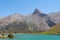 The Pamir range view and peaceful campsite on Kulikalon lake in Fann mountains in Tajikistan. Amasing colorful reflection in pure