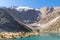 The Pamir range view and peaceful campsite on Kulikalon lake in Fann mountains in Tajikistan. Amasing colorful reflection in pure