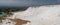 Pamukkale landsape panoramic view. White terraces with natural travertines in Pamukkale. Amazing scenery of calcium