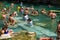PAMUKKALE, TURKEY-JUNE 23, 2018: Unknown tourists swim in the Ancient Cleopatra Pool in Pamukkale