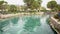 Pamukkale, Turkey: People swimming in ancient thermal pool of queen Cleopatra in a Hierapolis, Pamukkale