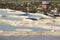 Pamukkale white mineral limestone natural pools and balloon. Turkey