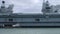 Pan along length of aircraft carrier HMS Prince of Wales