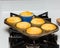 Pan of corn muffins fresh from the oven sitting in the stove