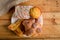 Pan de muerto and other sweet breads on a wooden table.