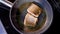 Pan-fried fish, Two pieces of loban fillet on the steaming frying pan.