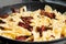 Pan-fried pasta with sun-dried tomatoes and garlic. Stages of cooking Italian cuisine