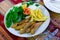 Pan-fried red mullet with fries, tomato, greens and lemon